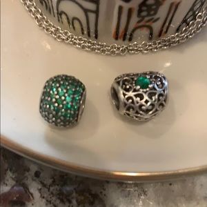 Two Pandora charms . Silver and green